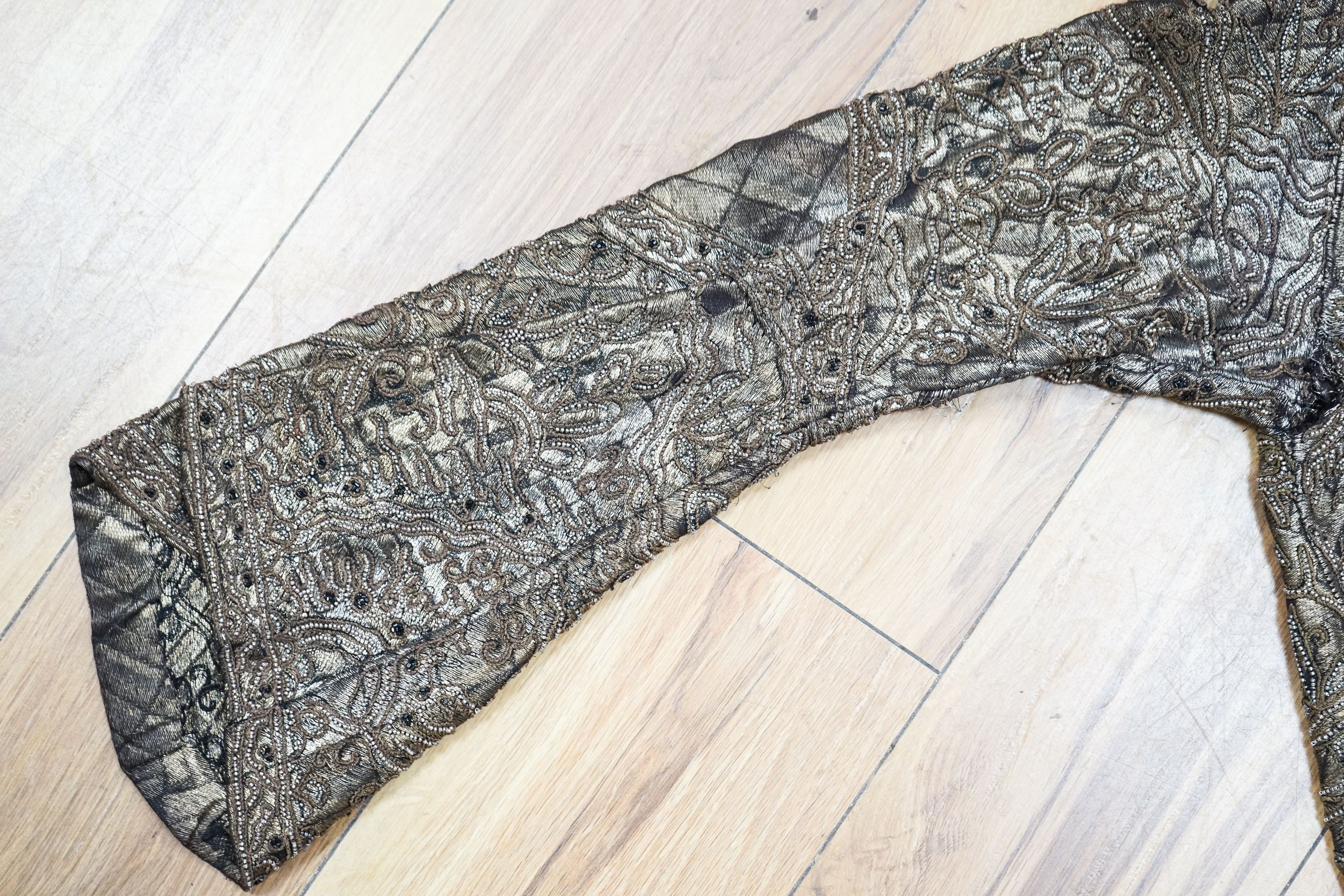 A 1920'3-30's evening bolero jacket in gold lame with silver beading and brown embroidery